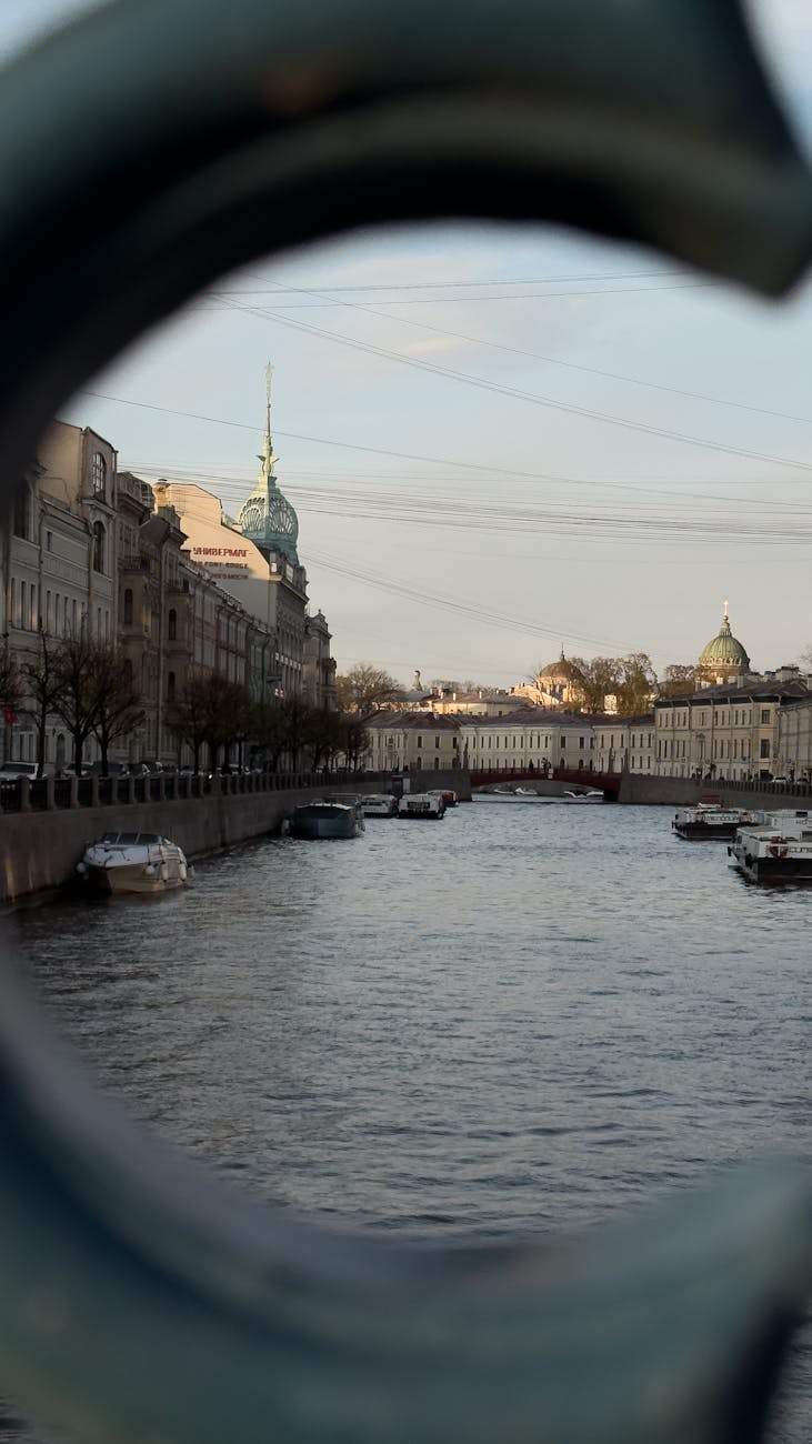 historic european canal view framed by arch